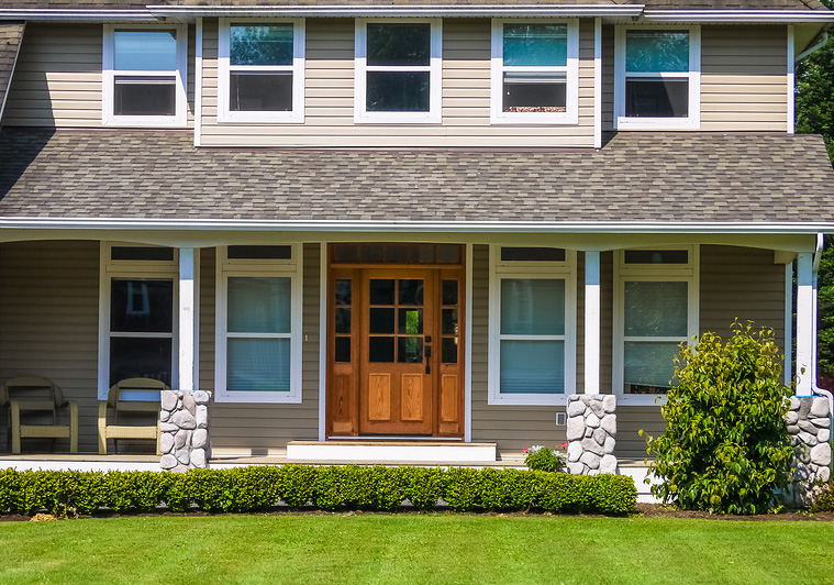 new entry door and replacement windows to improve curb appeal